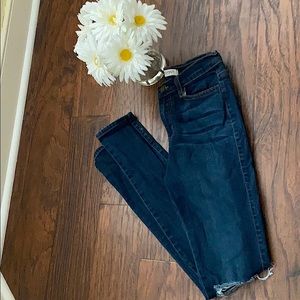 Vibrant MIU straight leg jeans with fashion tips on knee